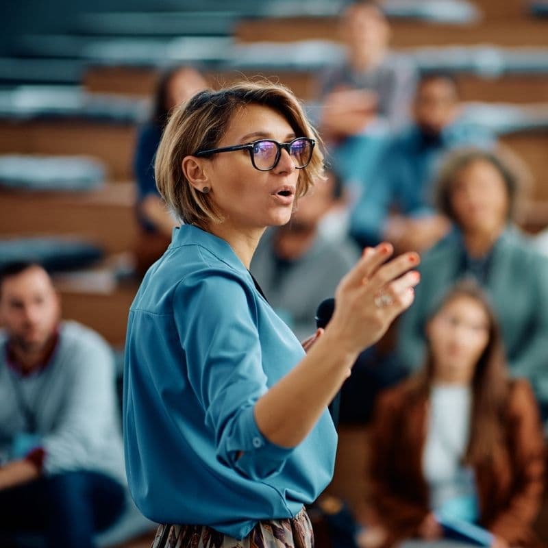 A Resilience Institute speaker presenting to a conference audience